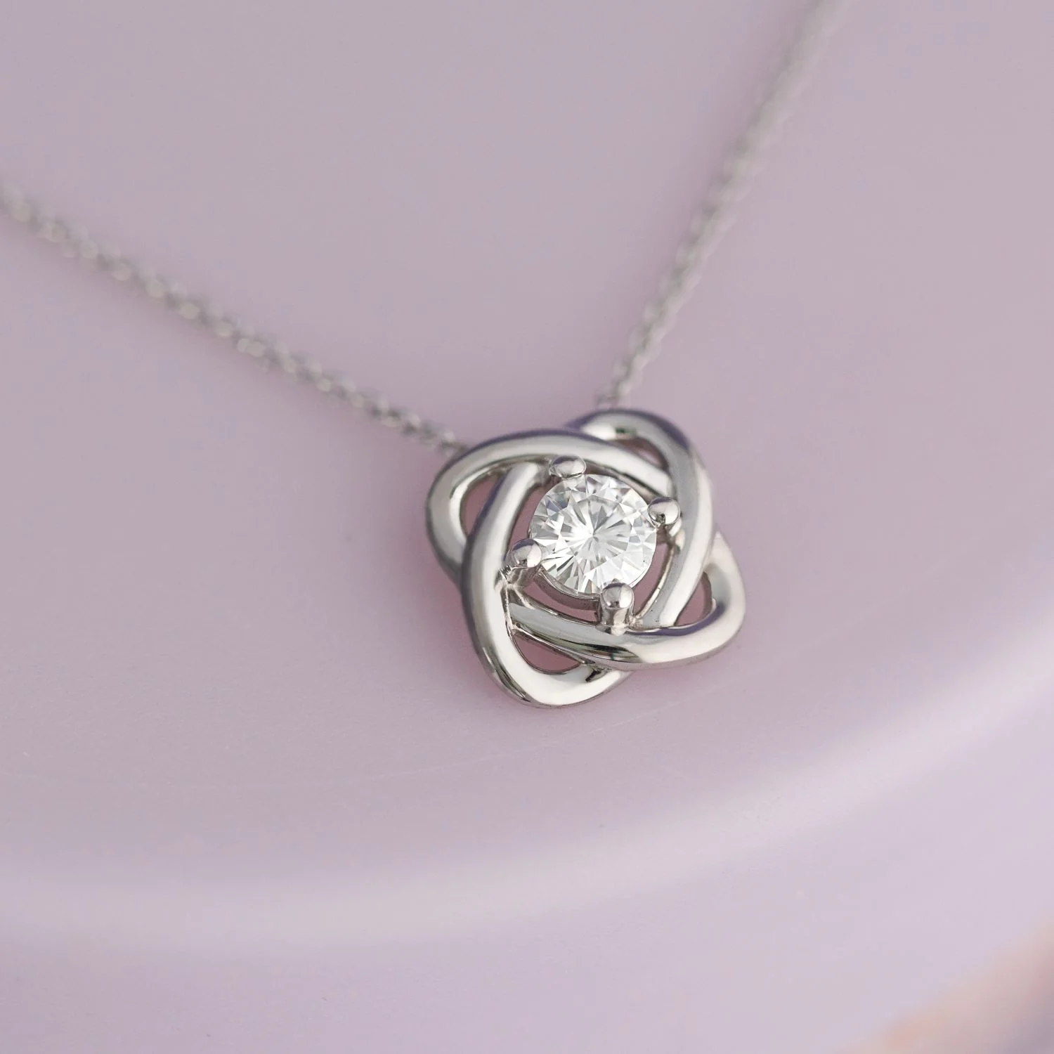 0.33 CTW DEW Round Moissanite Love Knot Pendant in Sterling Silver - Image 2